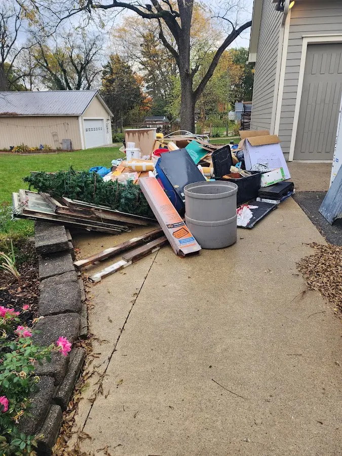 Dumpster being loaded with debris for Commercial Dumpster Rental in New Hope